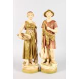 A MEDIUM SIZE PAIR OF ROYAL DUX FIGURES OF A CLASSICAL YOUNG MAN AND YOUNG GIRL, the man carrying