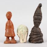 AN ANCIENT EGYPTIAN CARVED STONE HEAD AND TWO CARVED WOODEN FIGURES (3).