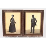 A PAIR OF VICTORIAN SILHOUETTES, full length of a gentleman and lady. 10ins x 7ins, framed and