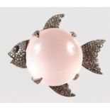 A GOOD ROSE QUARTZ AND ROSE DIAMOND FISH BROOCH.