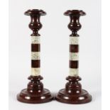 A LARGE PAIR OF VICTORIAN SERPENTINE TWO-COLOUR CANDLESTICKS with hexagonal stems, on circular