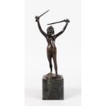 AN ART DECO BRONZE OF A NUDE STANDING HOLDING TWO SWORDS. 10ins high, on a marble base.