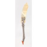 A PAPERKNIFE with mother-of-pearl blade, with stag mount and silver leg and hoof. 10ins long.