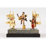 A SUPERB SMALL ORMOLU AND COLD PAINTED TWO BOTTLE INKSTAND with three figures on a faux-marble and