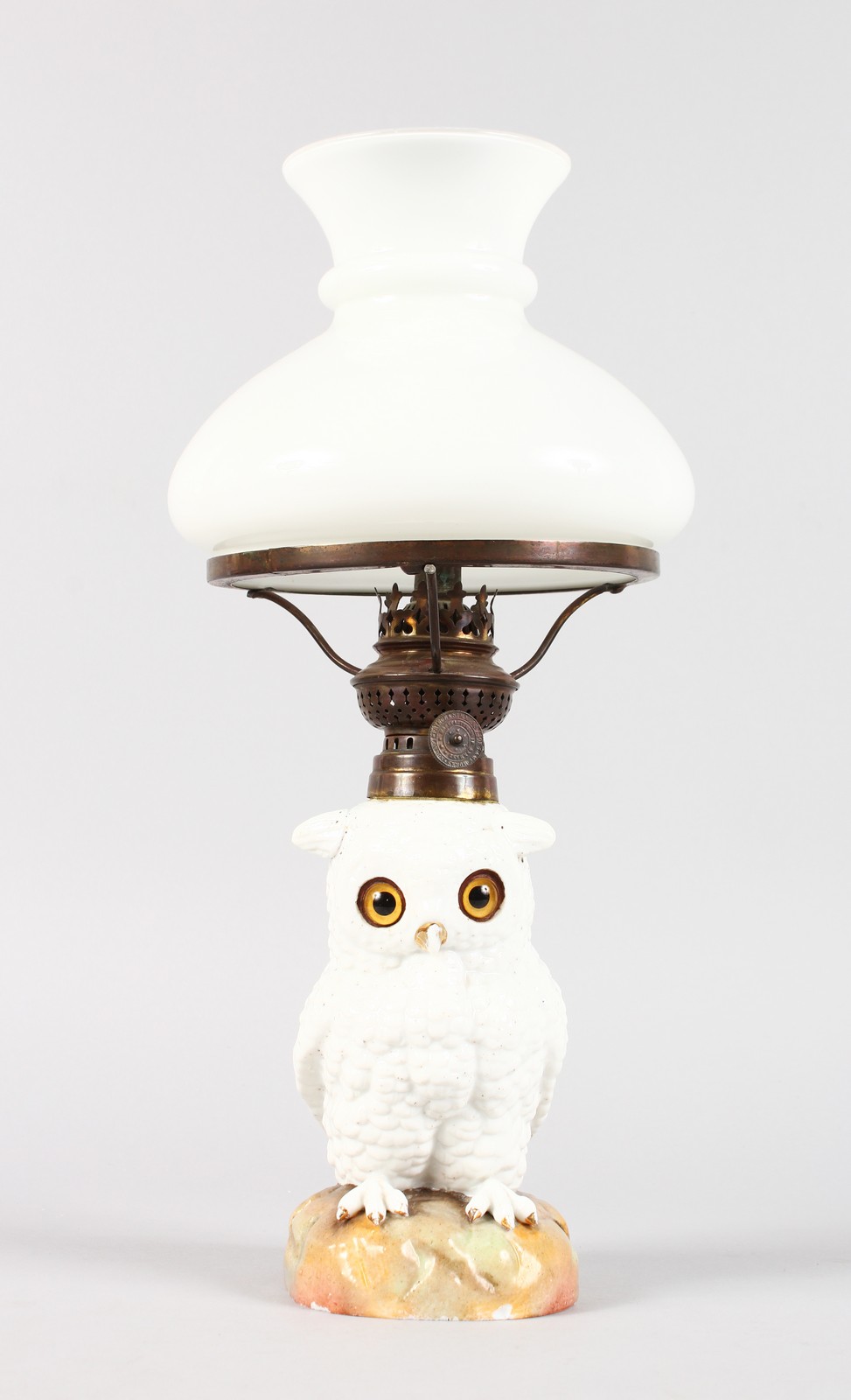 A CONTINENTAL WHITE PORCELAIN OWL LAMP BASE with glass eyes, complete with white shade. Owl 6.5ins