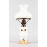 A CONTINENTAL WHITE PORCELAIN OWL LAMP BASE with glass eyes, complete with white shade. Owl 6.5ins