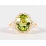 A 14K YELLOW GOLD AND DIAMOND RING SET WITH AN OVAL CUT PERIDOT, approx. 4.12ct, diamonds approx.