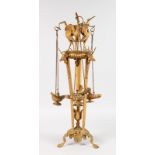 A "REGENCY" ORMOLU STAND of triangular shape with three oil lamps hanging from chains. 25ins high.