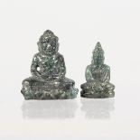 TWO CARVED TINY BUDDHAS, carved from precious stones. 14mm H and 12mm H