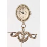 A LADIES SMITH MARCASITE FOB WATCH AND BOW.