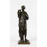 AFTER THE ANTIQUE A BRONZE OF A STANDING CLASSICAL FEMALE FIGURE on a square base. 16ins high.