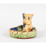 A ROYAL DOULTON STONEWARE ASHTRAY as a koala holding a stick with blue interior. 5.5ins diameter.