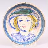 QUENTIN BELL (FULHAM POTTERY) 1910-1996 A CIRCULAR POTTERY BOWL painted with the head of a girl in