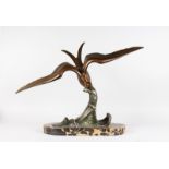 ROCHOT A BRONZE OF A SEAGULL FLYING ON A WAVE. Signed. 1ft 8ins high x 2ft 7ins long, on an oval