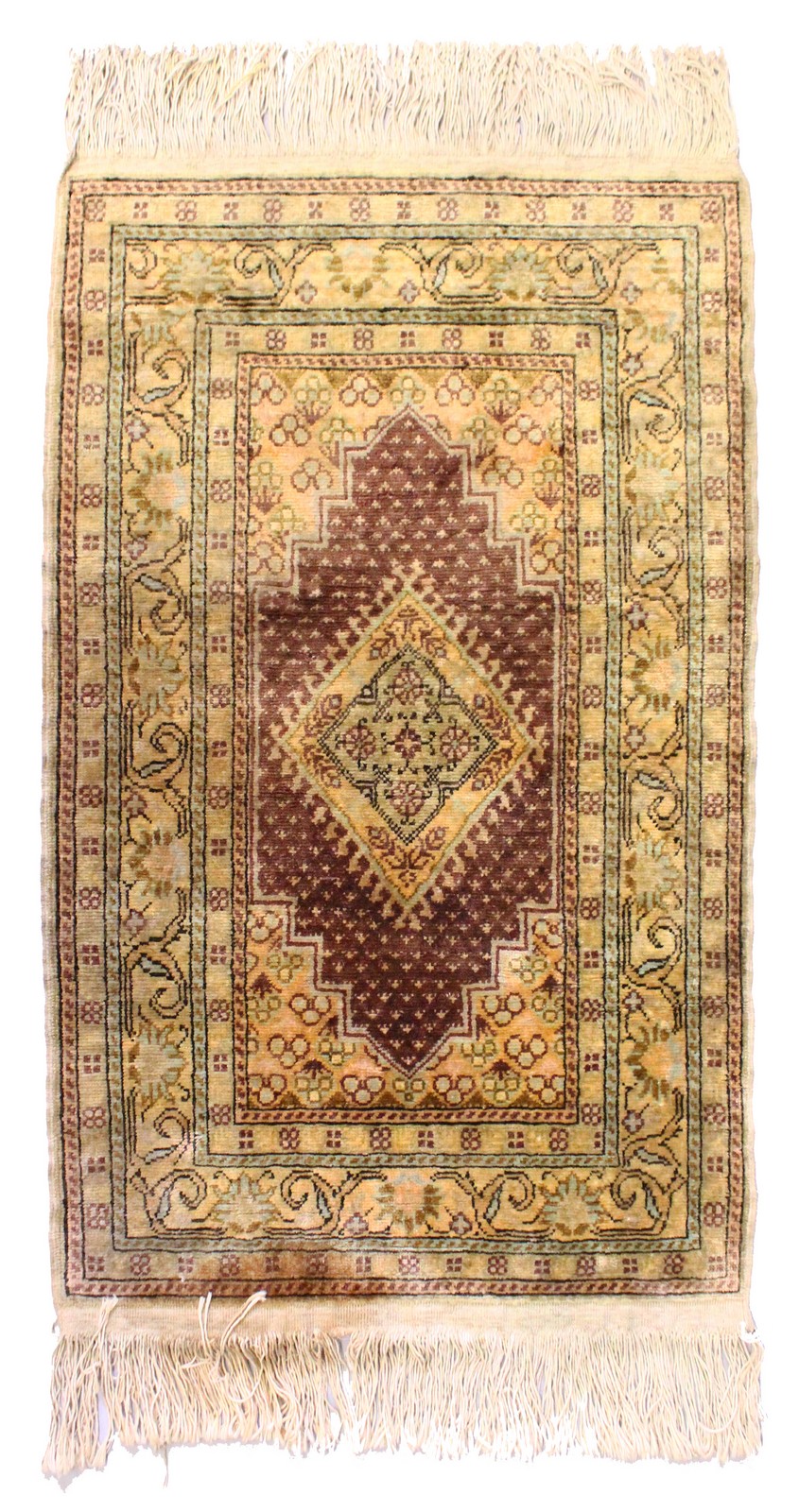 A SILKY WOOL PERSIAN RUG with central motif. 3ft 6ins long x 2ft wide.