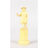 A SMALL EUROPEAN FIGURE OF A MAN standing on a plinth. 4.25ins high.