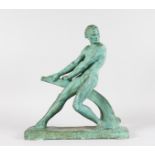 CIPRIANI A PAINTED TERRACOTTA STANDING NUDE pushing a rudder. Signed. 18ins high x 16ins long.