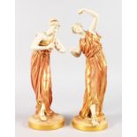 A GOOD PAIR OF ROYAL WORCESTER WHITE AND GILT PORCELAIN CLASSICAL FIGURES OF YOUNG LADIES, one