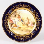 A VIENNA CIRCULAR PLATE, with rich blue and gilt border and the centre with a classical scene by