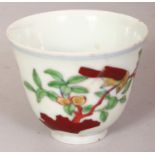 A CHINESE DOUCAI PORCELAIN TEABOWL, decorated with birds perched on flowering and fruiting stems,