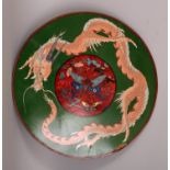 A JAPANESE MEIJI PERIOD CLOISONNE CIRCULAR DRAGON PLAQUE, with a central butterfly panel, 14.5in