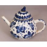 A CHINESE KANGXI PERIOD BLUE & WHITE FLUTED PORCELAIN TEAPOT & COVER, the sides painted with a