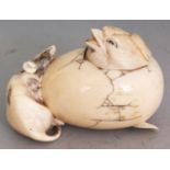 A JAPANESE MEIJI PERIOD IVORY BOX & COVER, well carved in the form of a chick emerging from an egg