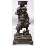 A VERY LARGE JAPANESE MEIJI PERIOD BRONZE FIGURE OF AN ONI GOD, supporting a bowl above his head and