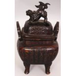 A JAPANESE MEIJI PERIOD BRONZE KORO & COVER, the sides cast with columns of calligraphy, 7.5in