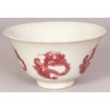 A CHINESE COPPER-RED PORCELAIN DRAGON BOWL, the base with a six-character Kangxi mark, 5.6in