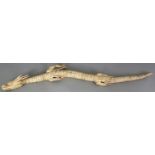 A GOOD JAPANESE MEIJI PERIOD BONE IVORY ARTICULATED MODEL OF A DRAGON, with moveable body, head