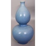 A CHINESE CLAIRE-DE-LUNE DOUBLE GOURD PORCELAIN VASE, applied with a crackled glaze, 8.7in high.