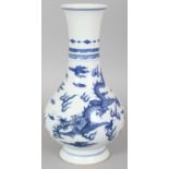 A CHINESE BLUE & WHITE PORCELAIN DRAGON VASE, with a ribbed neck, 9.9in high.