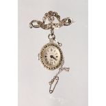 A LADIES' SMITHS MARCASITE BROOCH WATCH.