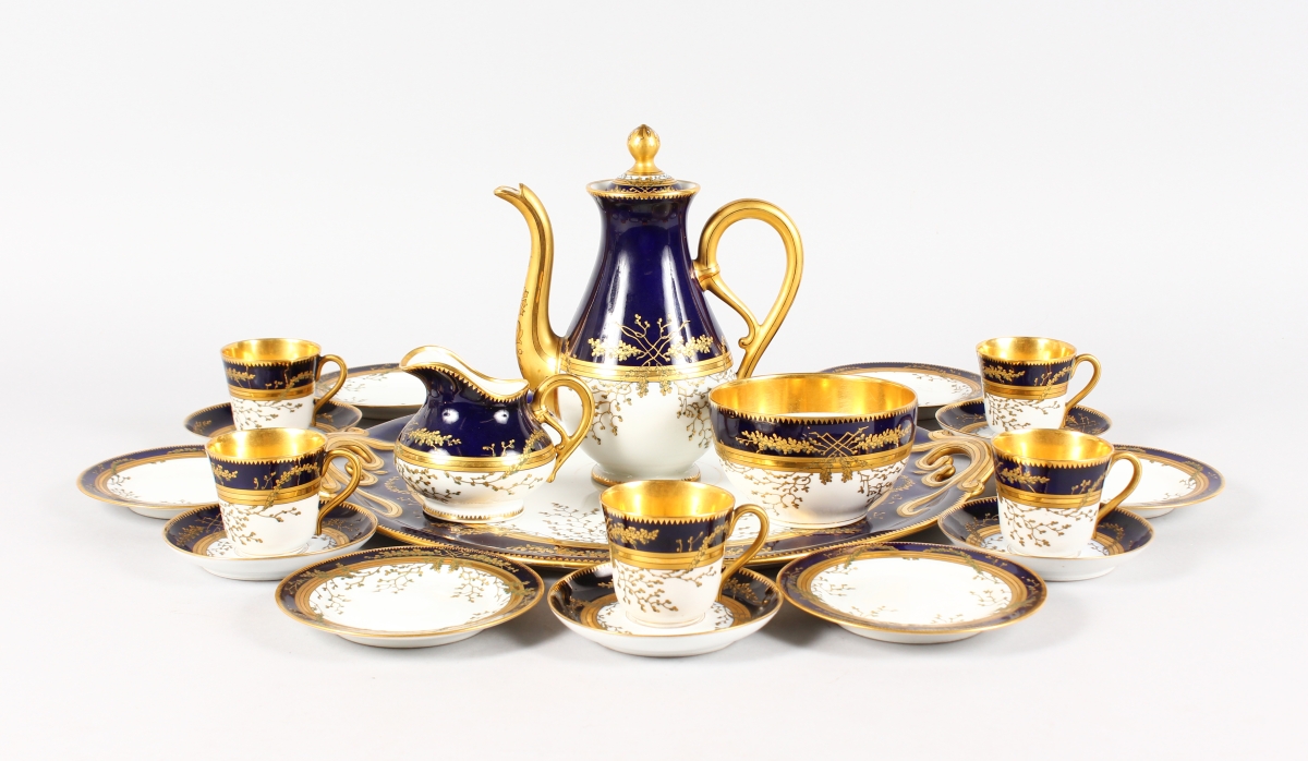 AN AUSTRIAN PORCELAIN TEA SET, on a tray with jug, tea or coffee pot, sugar bowl, five cups and