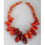 A CARNELIAN HARDSTONE NECKLACE, composed of irregular graduated beads, approx. 19.5in long.