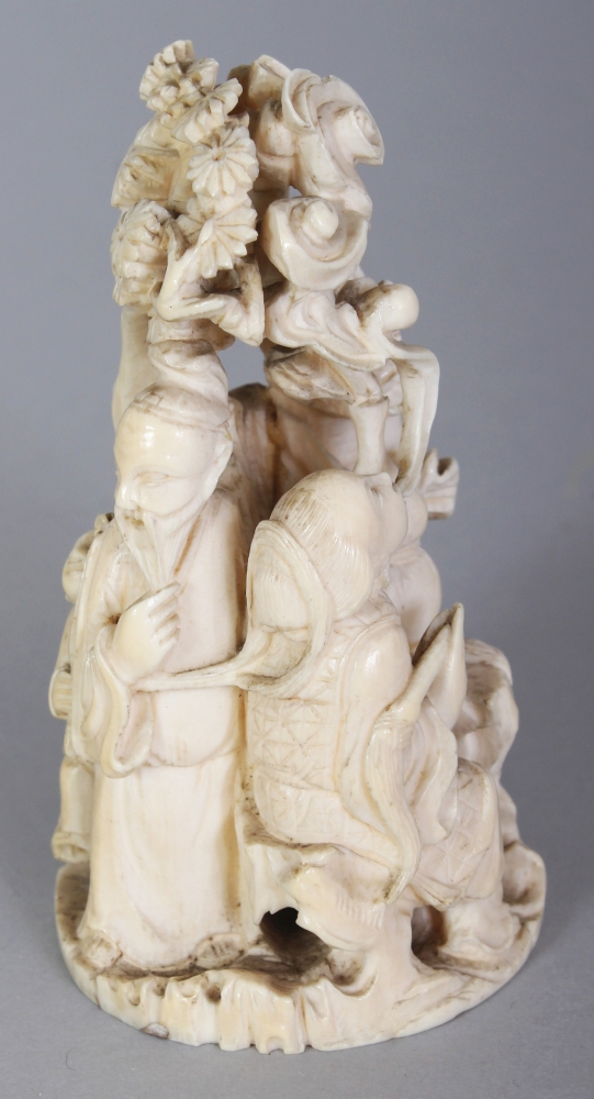 A JAPANESE MEIJI PERIOD IVORY OKIMONO OF A GROUP OF THREE IMMORTALS & A BOY ATTENDANT IN A PINE - Image 2 of 9