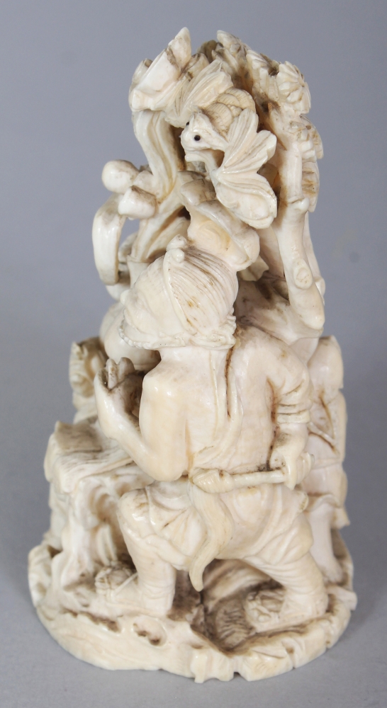 A JAPANESE MEIJI PERIOD IVORY OKIMONO OF A GROUP OF THREE IMMORTALS & A BOY ATTENDANT IN A PINE - Image 4 of 9