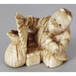 A SMALL JAPANESE MEIJI PERIOD IVORY NETSUKE OF A SEATED PERFORMER, unsigned, holding a fan and