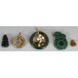 FIVE VARIOUS CHINESE HARDSTONE PENDANTS, the largest 2in diameter. (5)