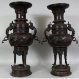 A LARGE PAIR OF ELABORATE JAPANESE MEIJI PERIOD BRONZE TRIPOD VASES, each with double Baku