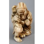 A JAPANESE MEIJI PERIOD IVORY NETSUKE OF EBISU, unsigned, the kneeling deity carrying a monkey