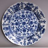 A GOOD QUALITY CHINESE KANGXI PERIOD BLUE & WHITE PORCELAIN PLATE, circa 1700, of larger than