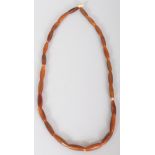 A GOOD QUALITY HORN NECKLACE, possibly Rhinoceros horn, weighing approx. 25gm, the beads of extended