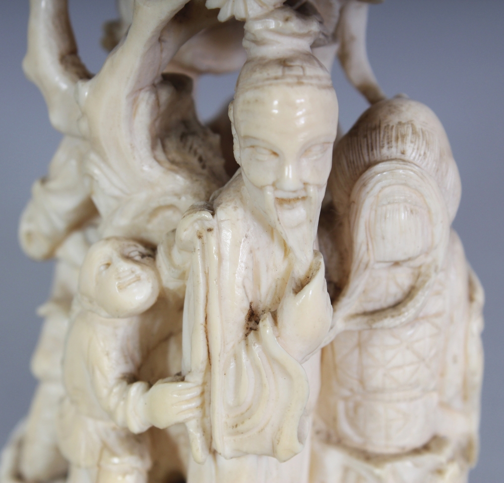 A JAPANESE MEIJI PERIOD IVORY OKIMONO OF A GROUP OF THREE IMMORTALS & A BOY ATTENDANT IN A PINE - Image 7 of 9