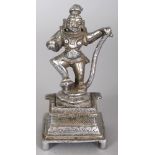 A 19TH/20TH CENTURY SILVERED BRONZE FIGURE OF SHIVA, holding a sphere and dancing on a square-