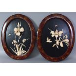 A PAIR OF JAPANESE MEIJI PERIOD OVAL ONLAID LACQUERED WOOD PANELS, each in a red-ground lacquered