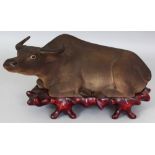 A GOOD JAPANESE MEIJI PERIOD BIZEN WARE POTTERY MODEL OF A WATER BUFFALO, together with a fitted