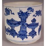 A CHINESE KANGXI PERIOD BLUE & WHITE PORCELAIN CYLINDRICAL POT,circa 1700, the sides painted in a