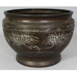 AN EARLY 20TH CENTURY JAPANESE BRONZE JARDINIERE, the sides decorated with peony in shallow